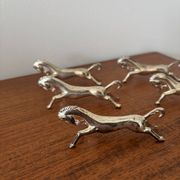 Set of 6 vintage galloping horse knife rests in silver-plated metal.