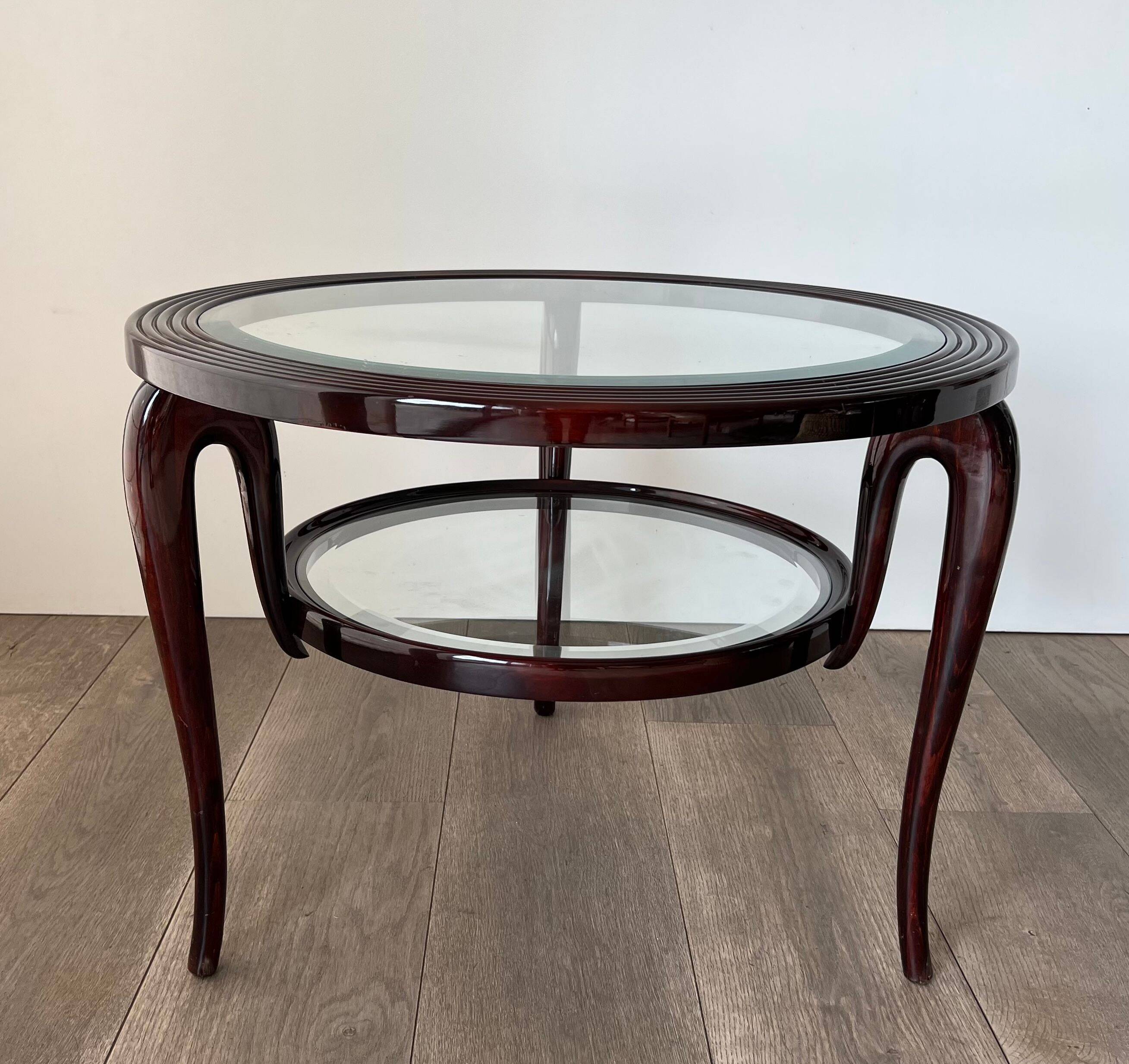 Round mid-century coffee table in walnut with a double top by Paolo Buffa.