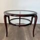 Round mid-century coffee table in walnut with a double top by Paolo Buffa.