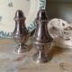Silver-plated salt and pepper shakers, fluted, beaded decoration.