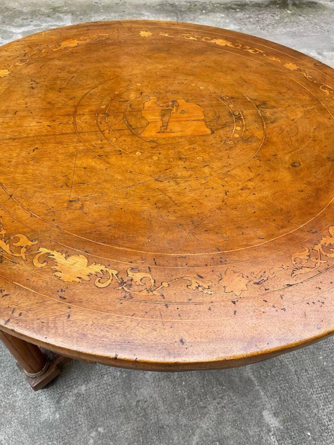 Antique round marquetry Empire table from the early 19th century