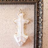 Antique holy water font in white porcelain biscuit.