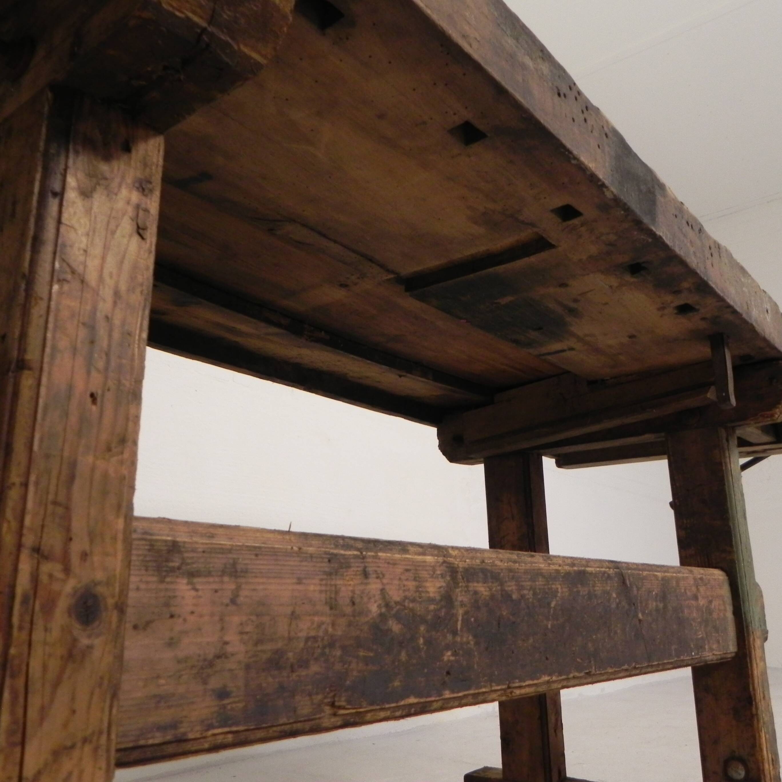 Wooden industrial workbench with vice, 194 cm long, 1930s.