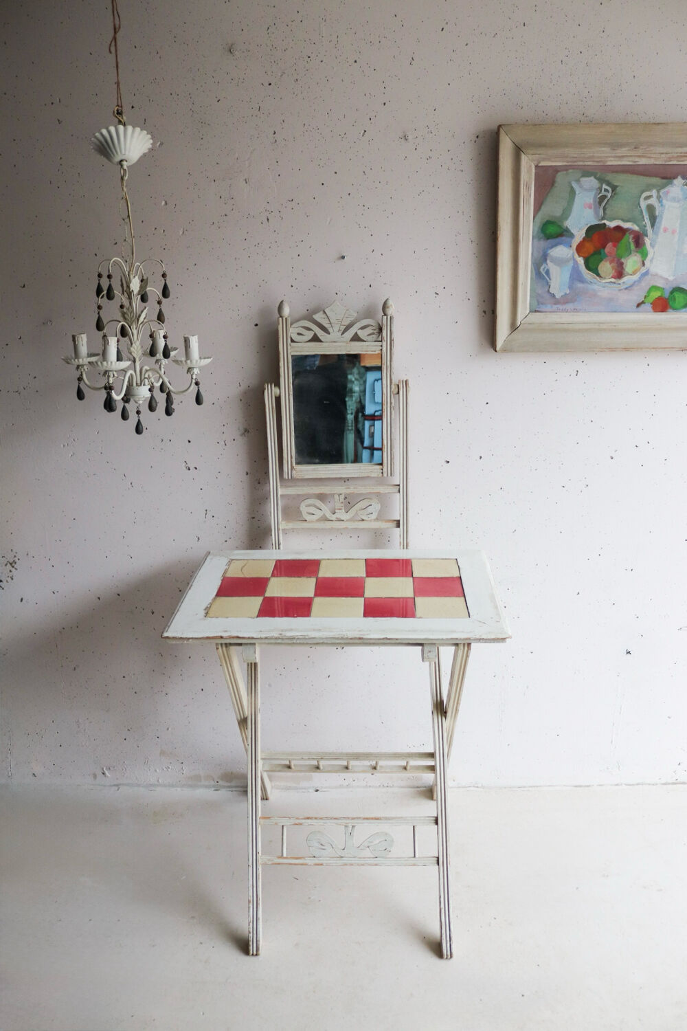 Small antique folding wooden dressing table with tiles and a mercury mirror.