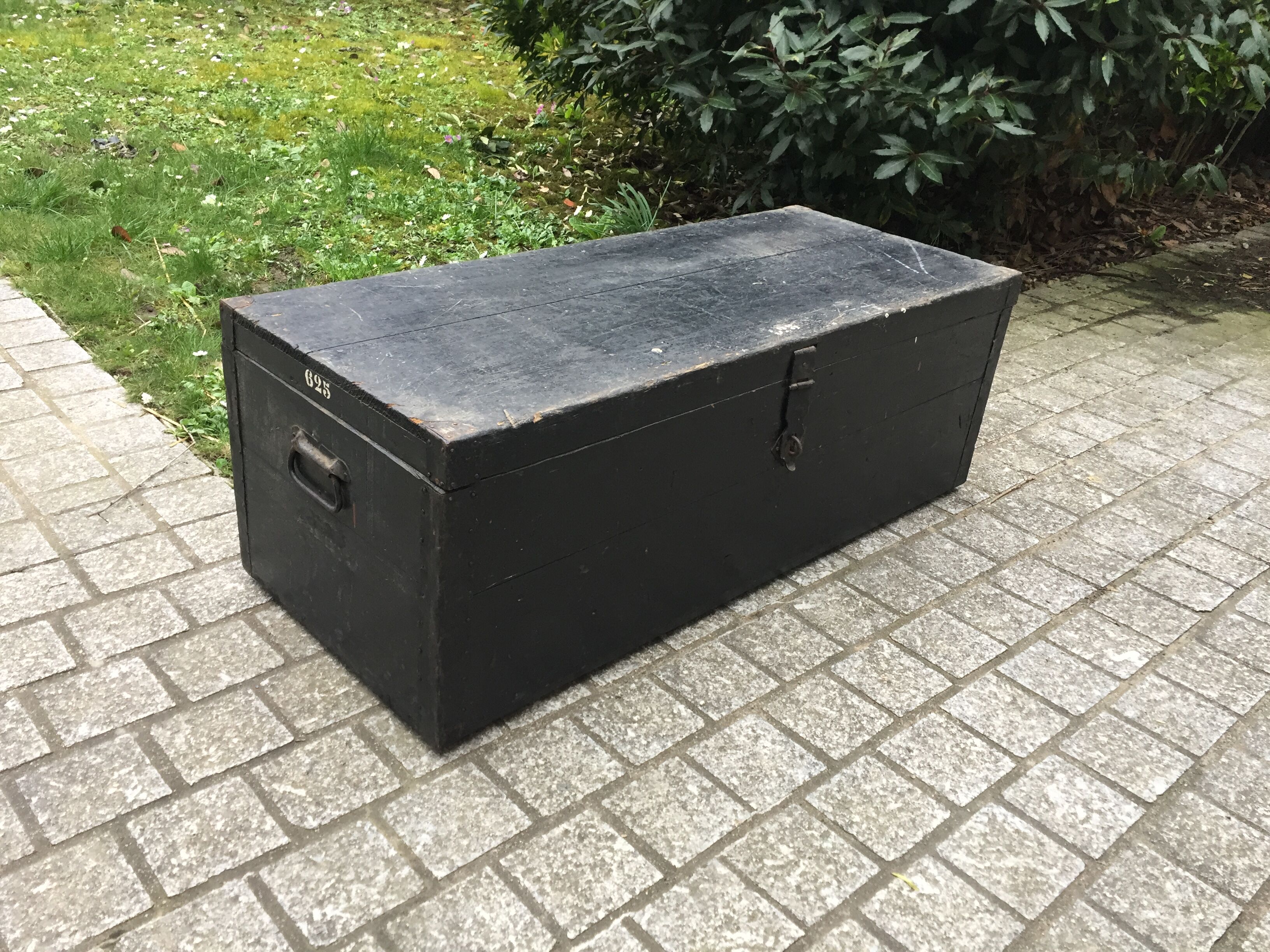 Old chest or wooden trunk black patina