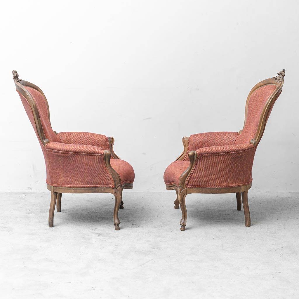 Pair of classic vintage armchairs in carved wood and fabric, 1950s