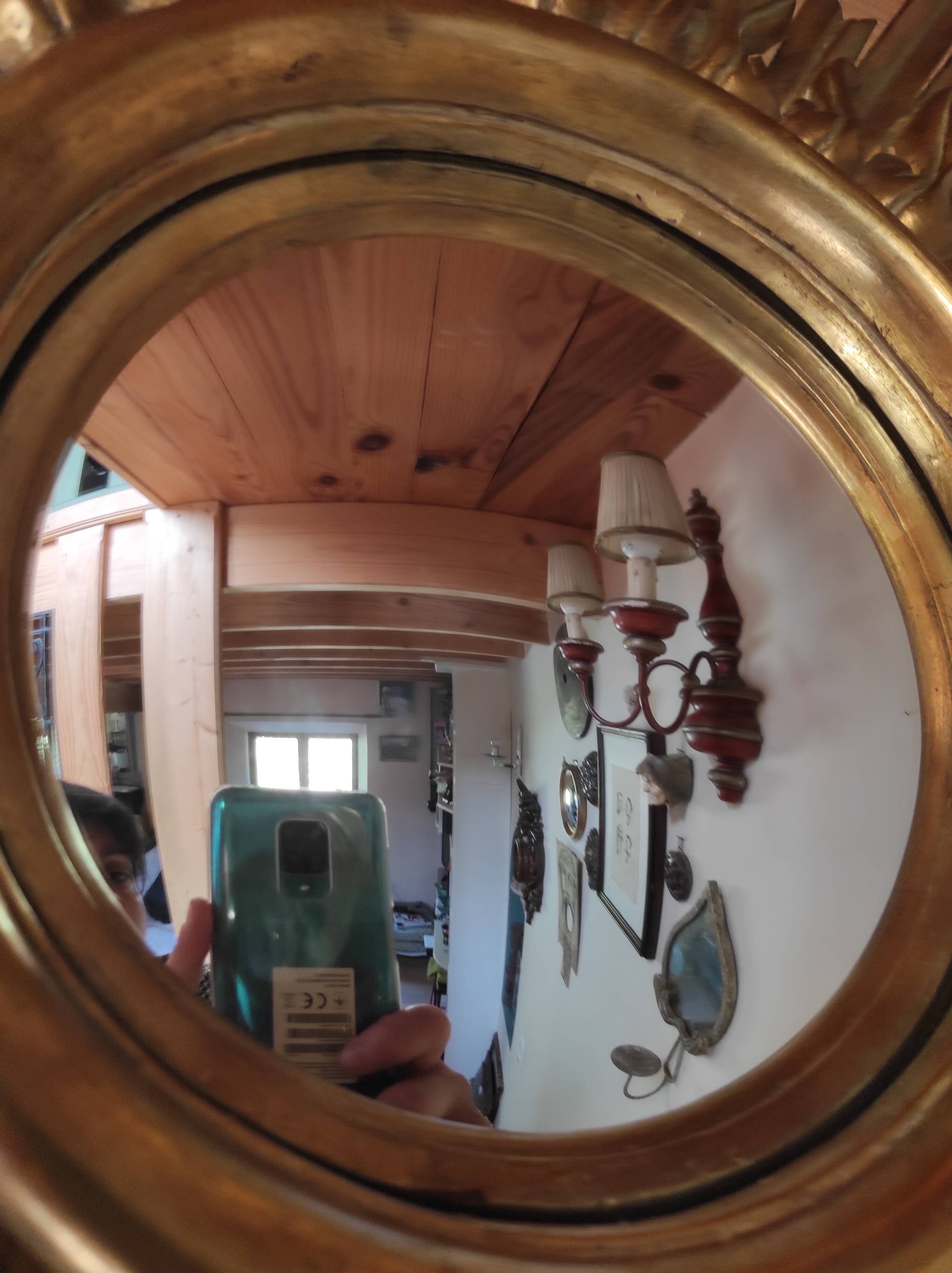 Sun mirror and witch's eye in gilded wood