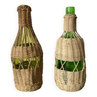 Glass bottles and woven rattan
