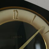 Famous black vintage mechanical wall clock