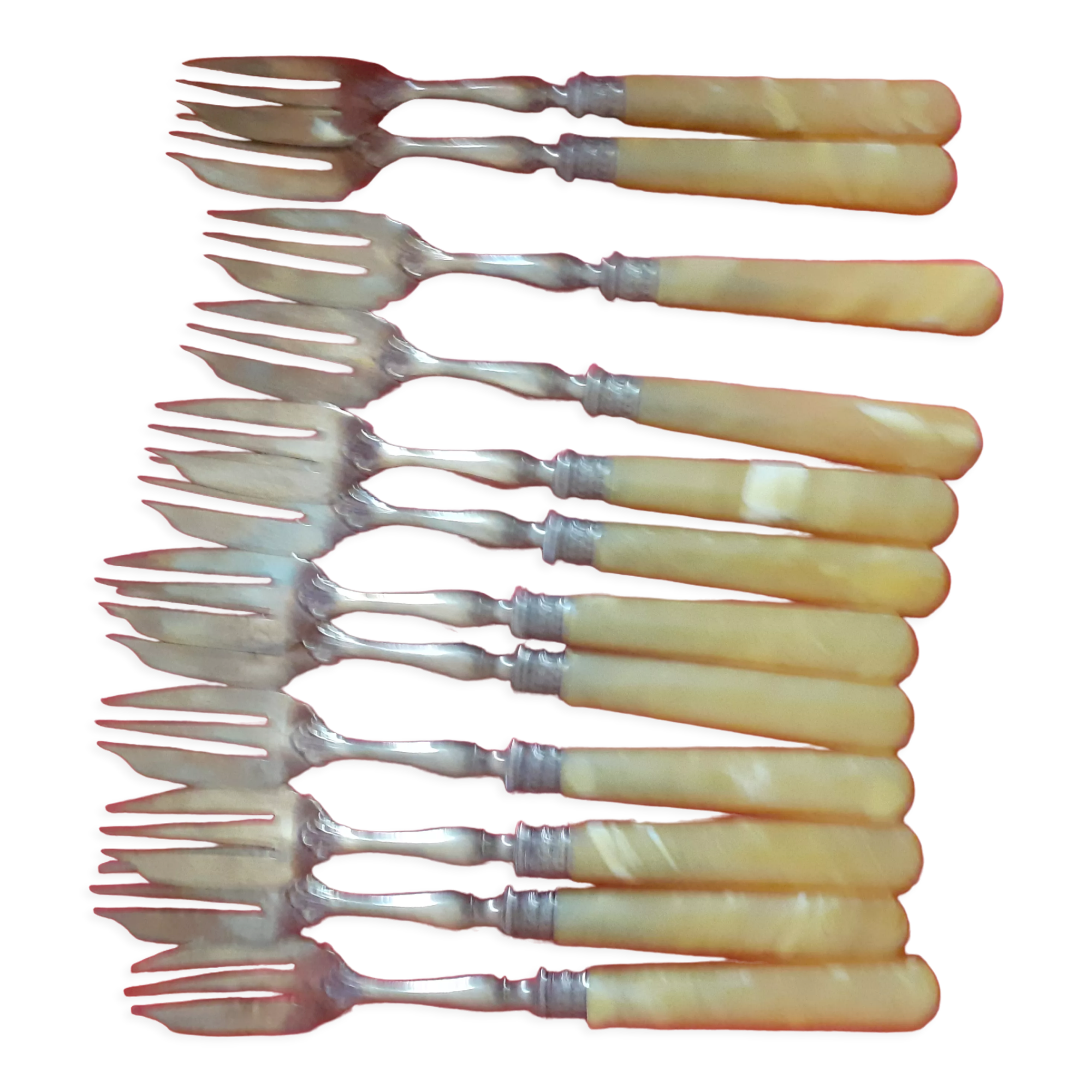 12 Cake forks. Around 1930. Golden metal and yellow Bakelite handle.