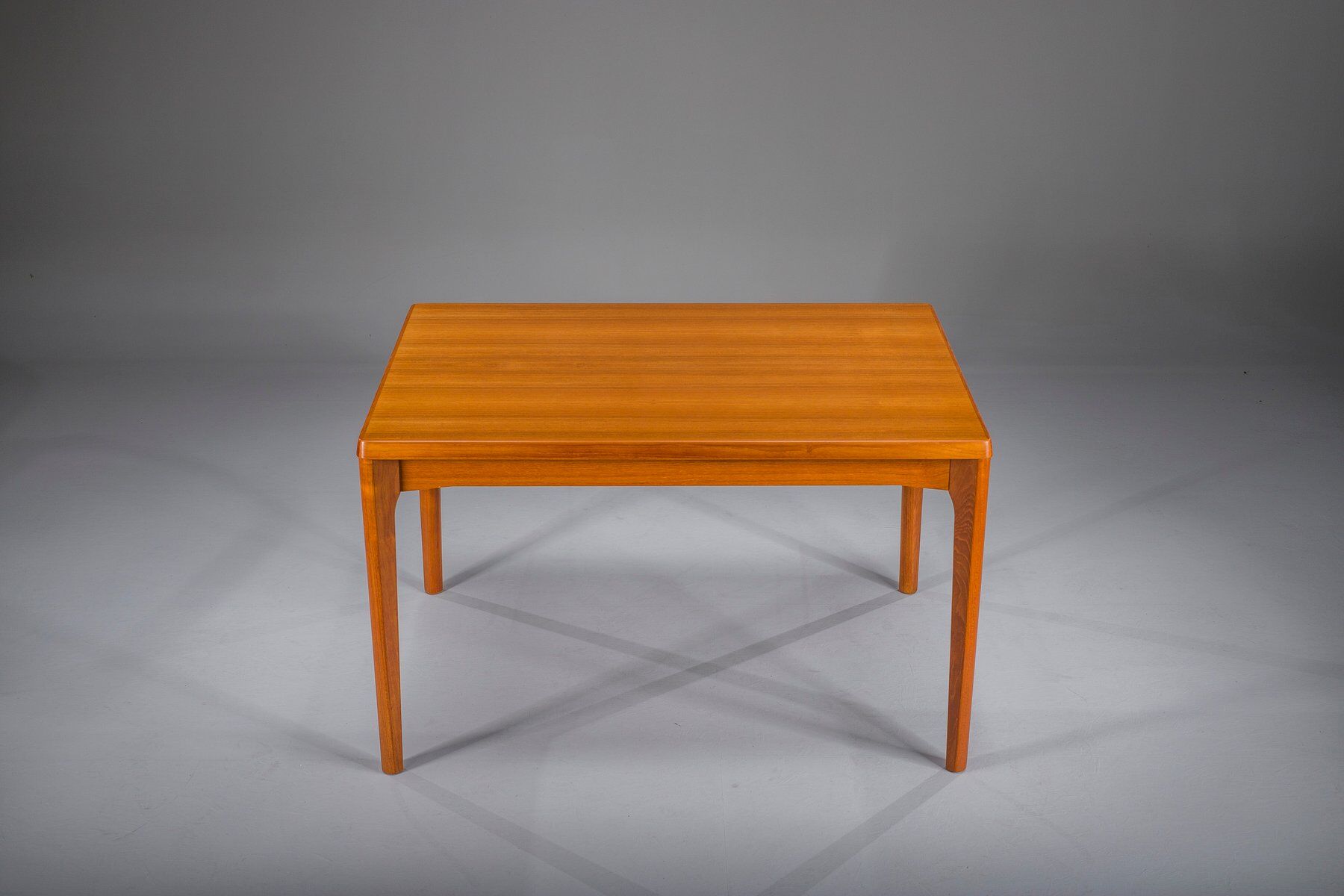 Extendable teak dining table by Henning Kjaernulf for Vejle Stole & Møbelfabrik