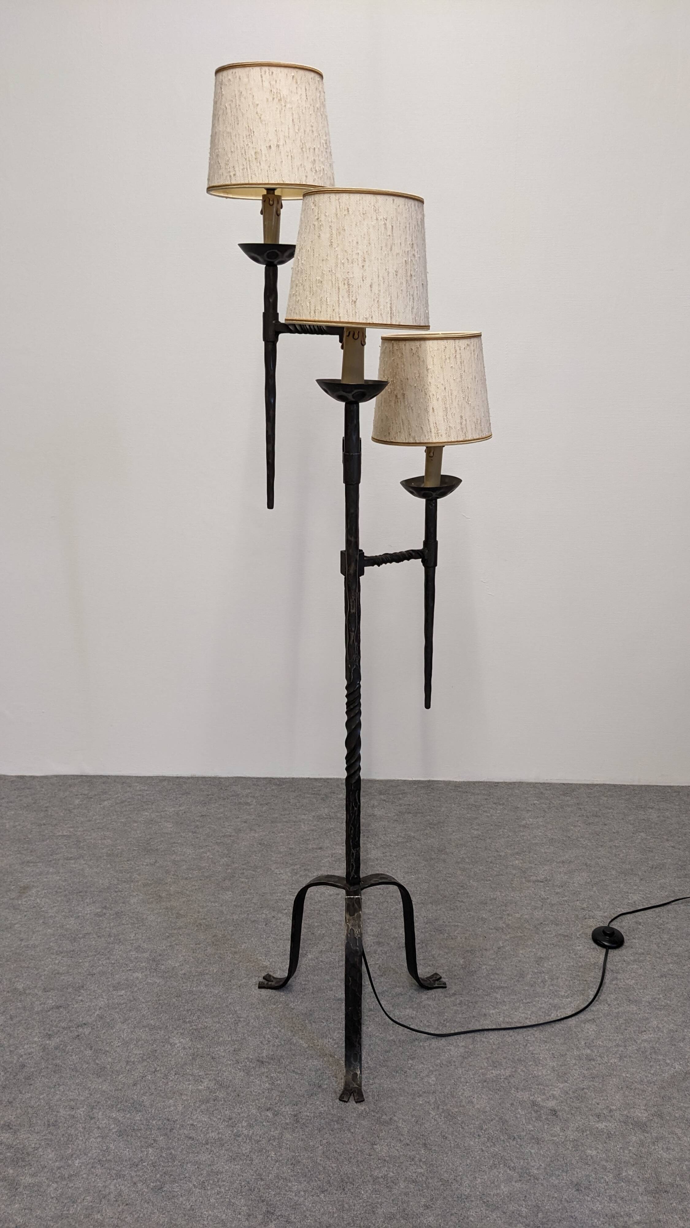 Brutalist tripod floor lamp with 3 lights in wrought iron, France circa 1950.