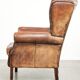 Vintage sheepskin wingback armchair in a deep brown colour finished