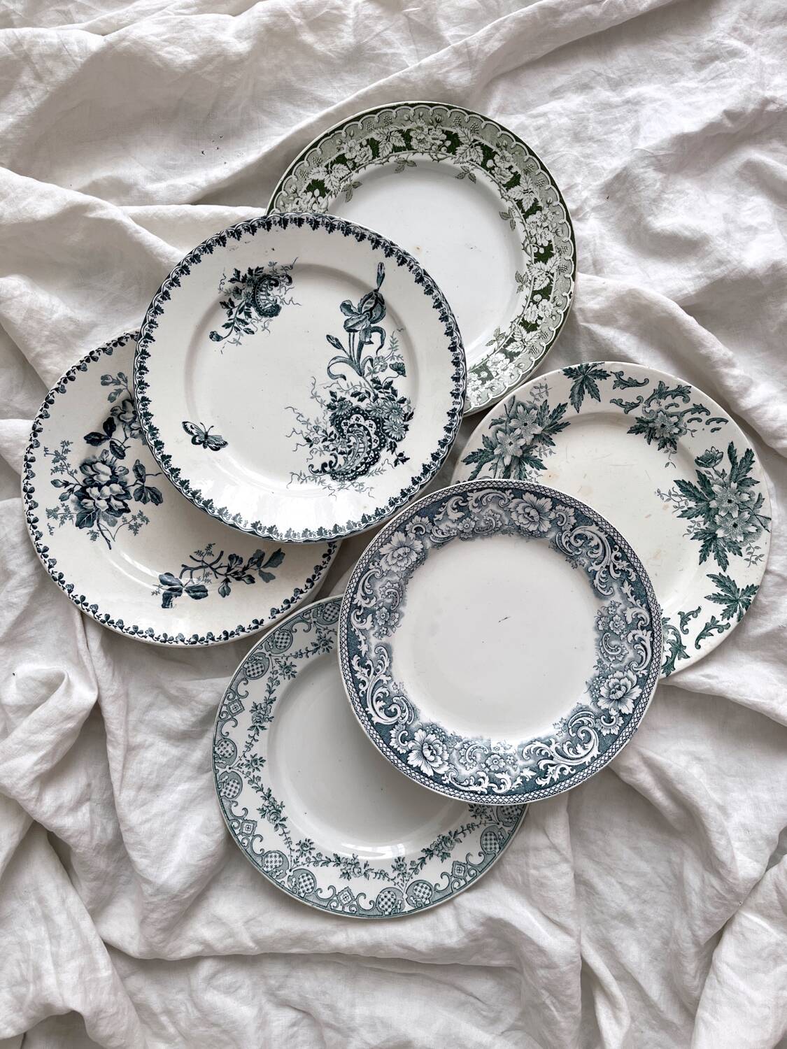 6 mismatched Saint Amand ironware dessert plates