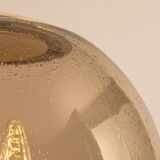 Large Limburg pendant light in brass with smoked glass ball, Germany, 1970s.
