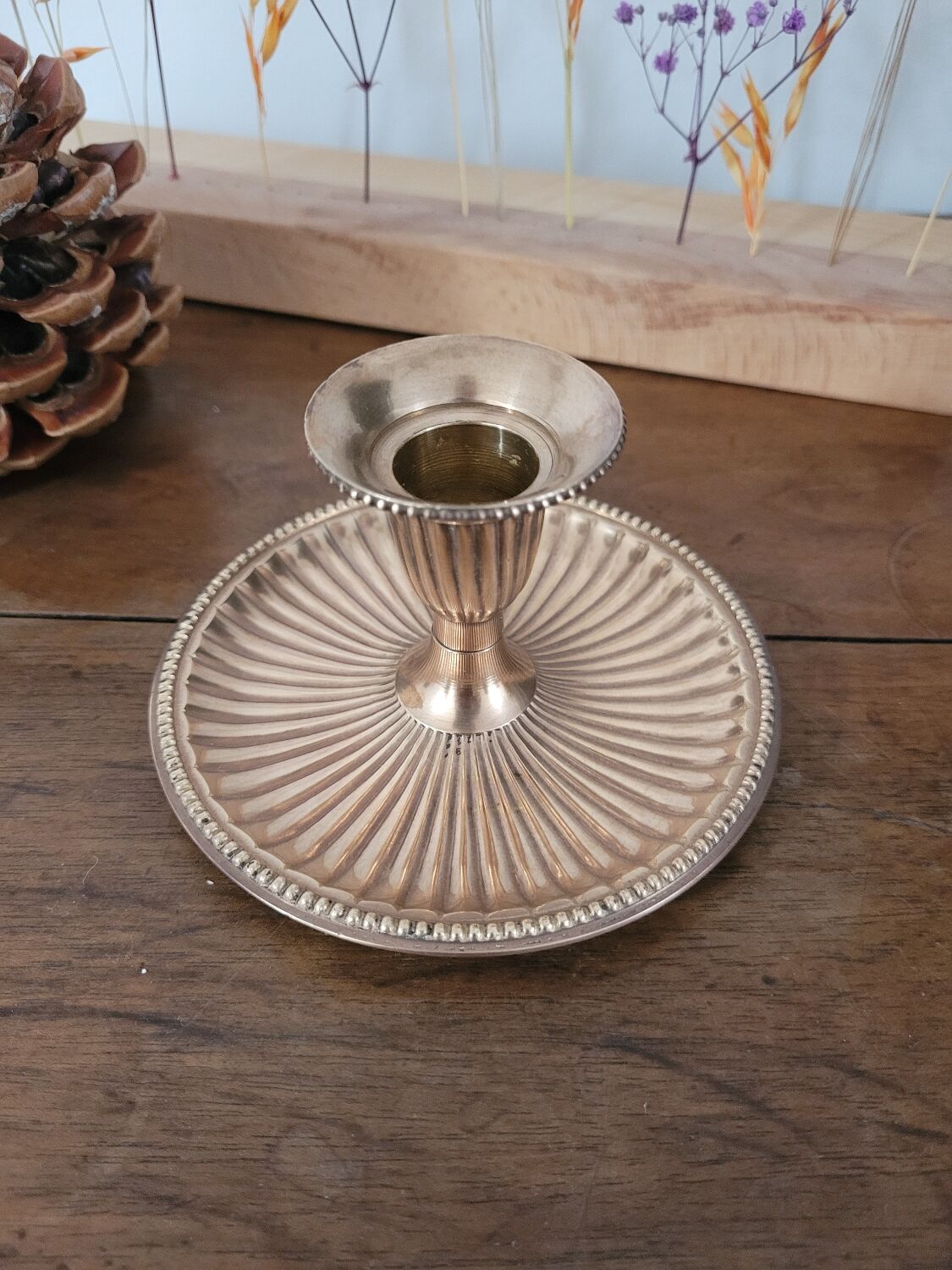 Brass candlestick with a ribbed dish