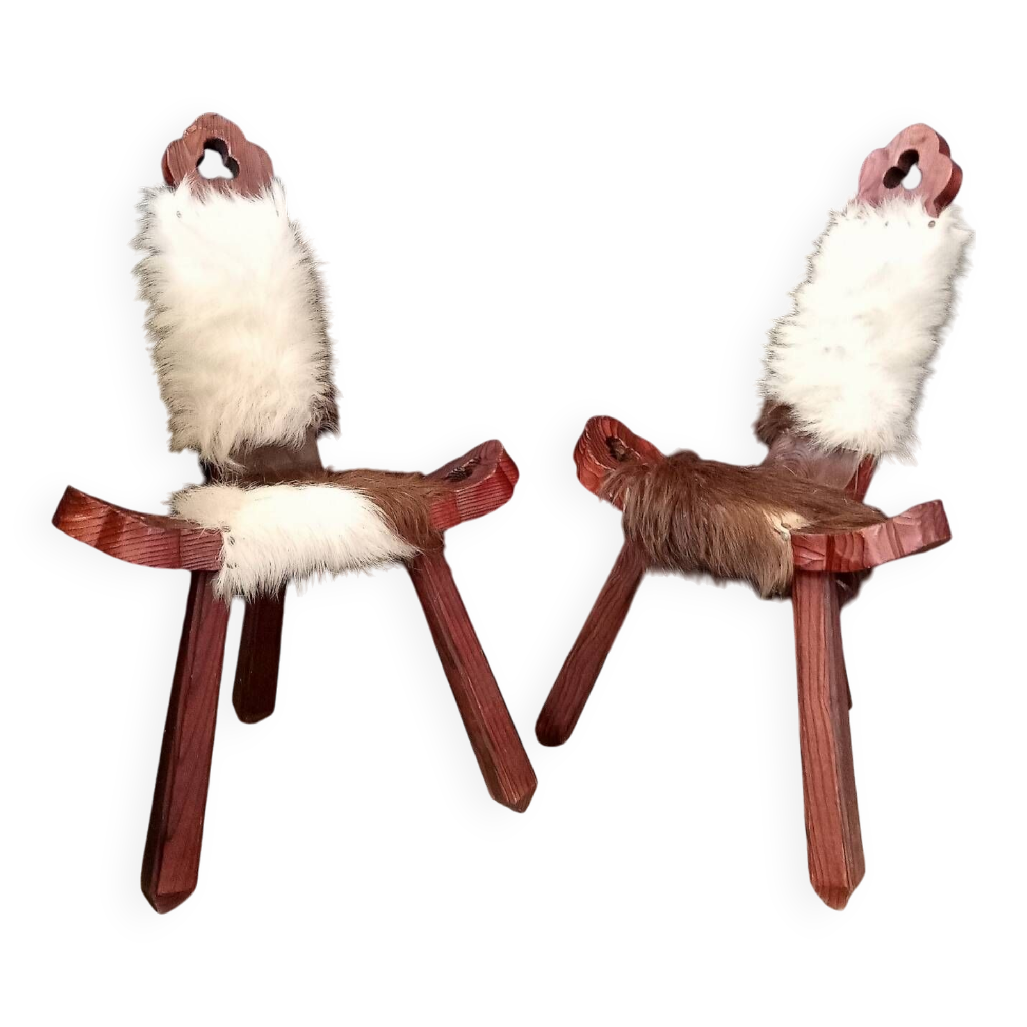 Pair of brutalist tripod chairs in wood and cowhide