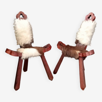 Pair of brutalist cowhide tripod chairs