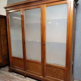 Large pine bookcase with three doors, fitted with frosted glass.