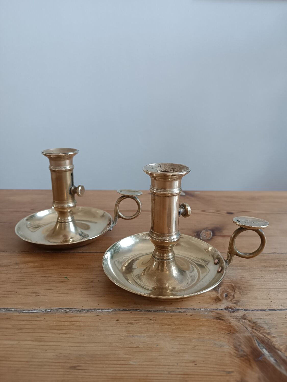 Duo of gilded brass cellar rat candlesticks