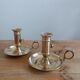 Duo of gilded brass cellar rat candlesticks
