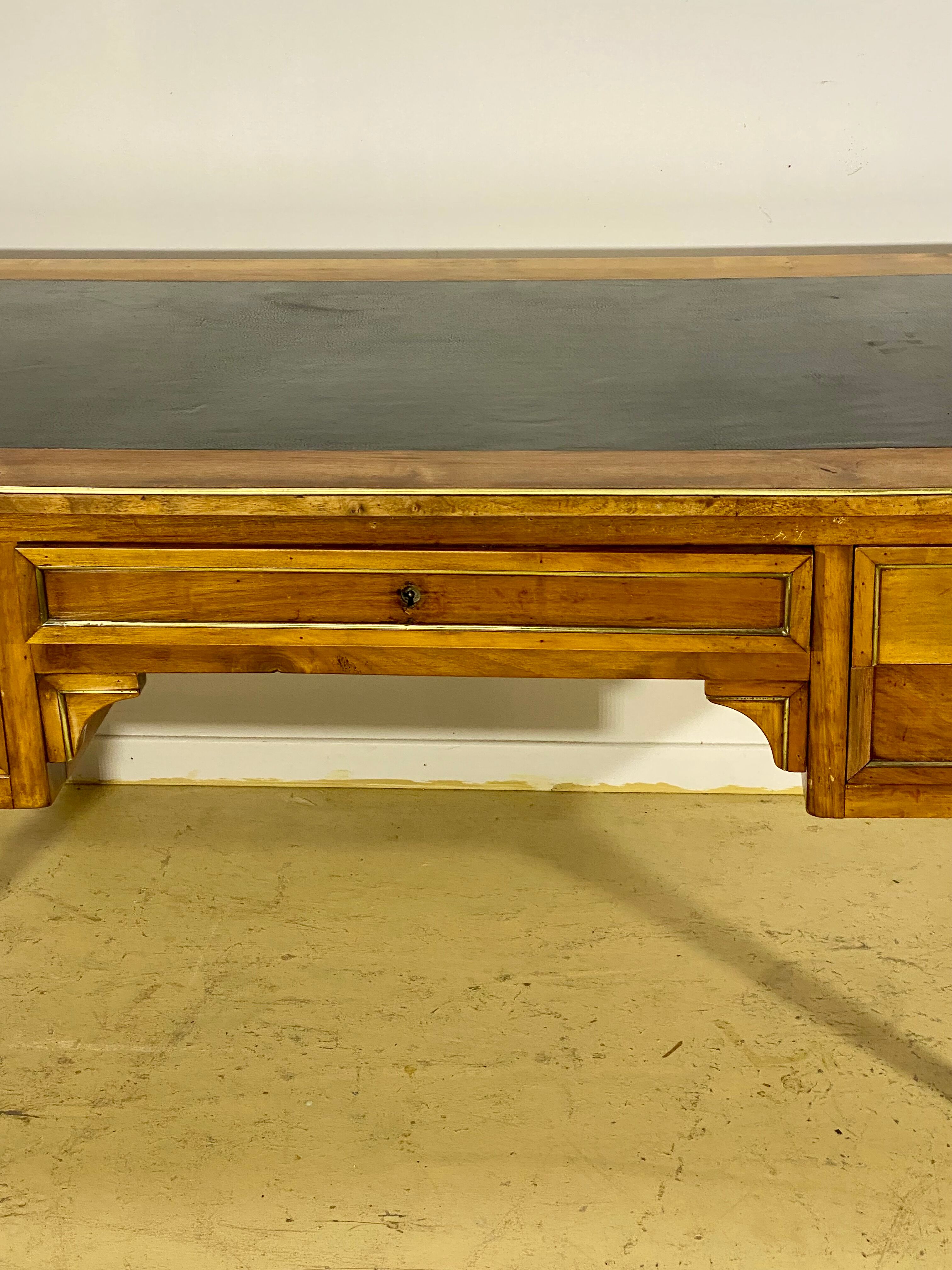 Louis XVI style desk in walnut veneer and brass fillets