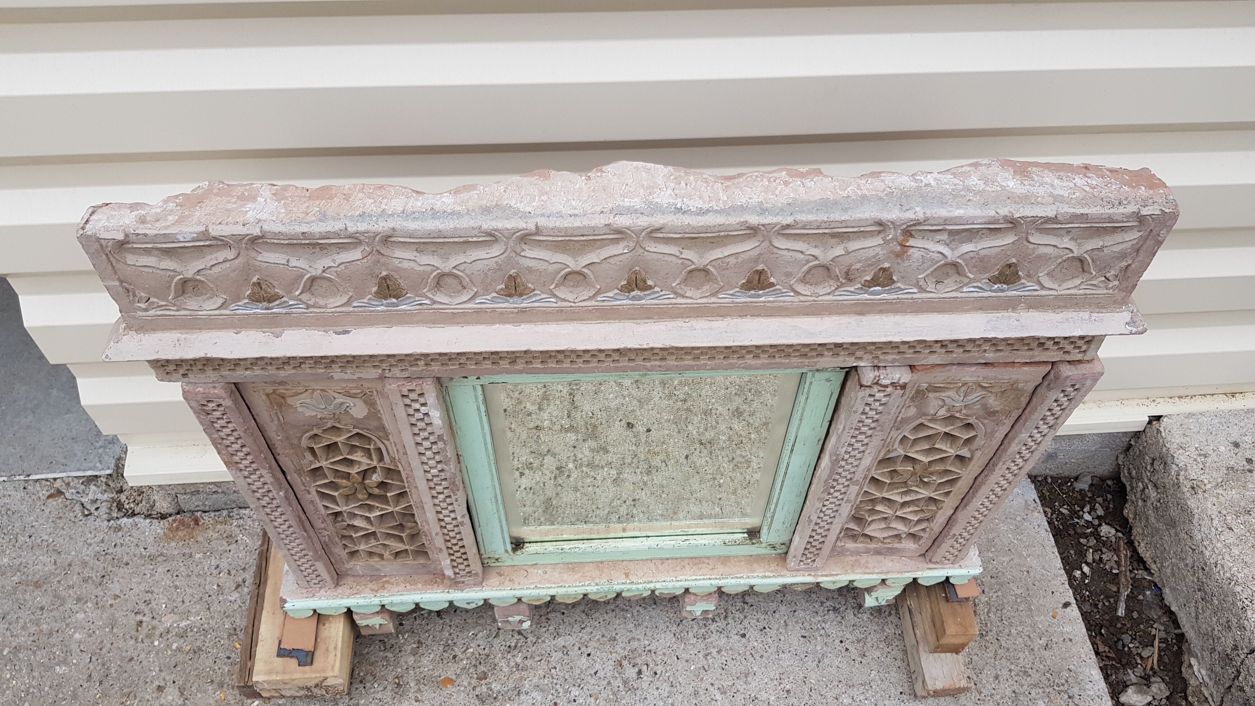 Fully hand-carved stone window with mirror