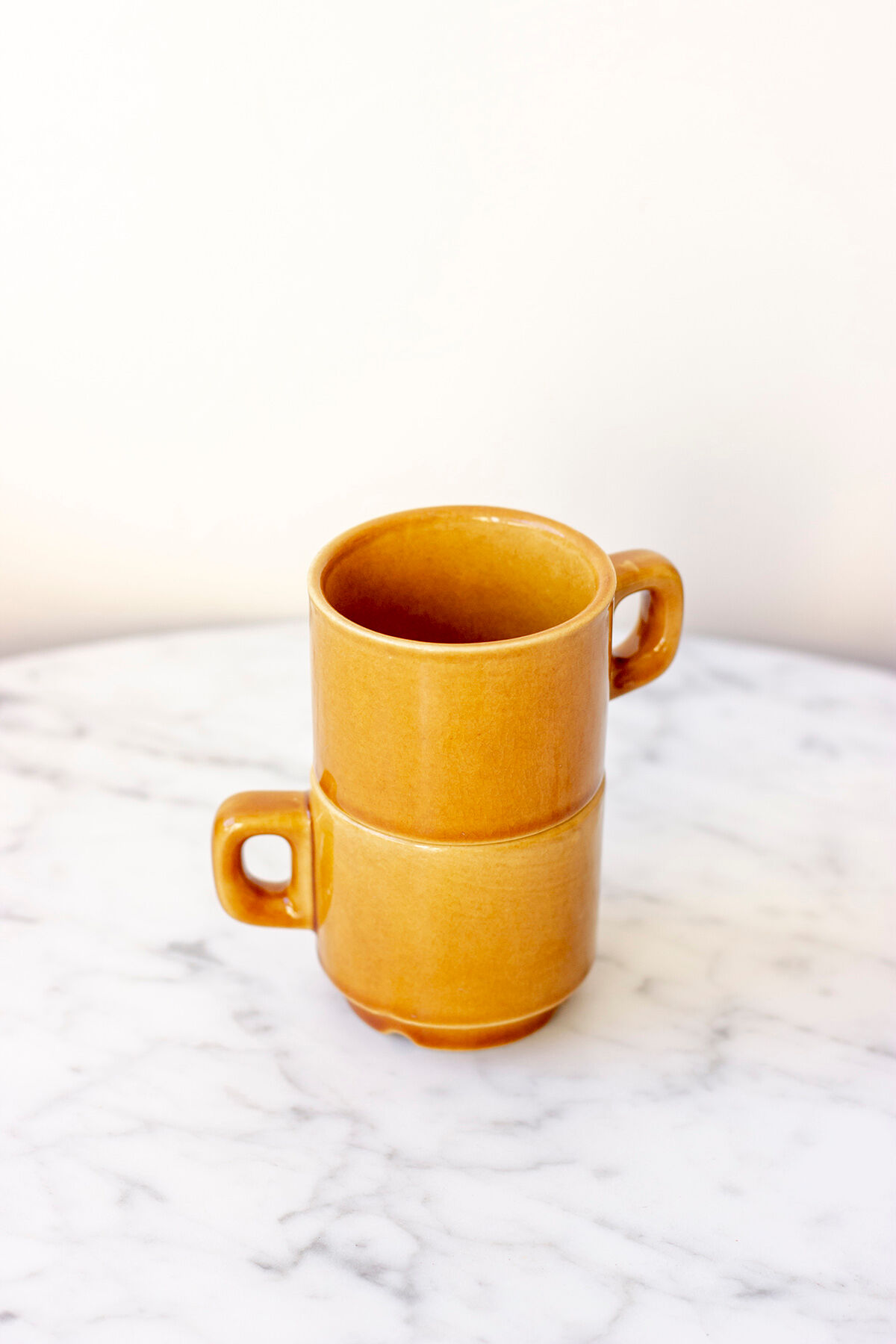 Pair of ochre yellow coffee cups