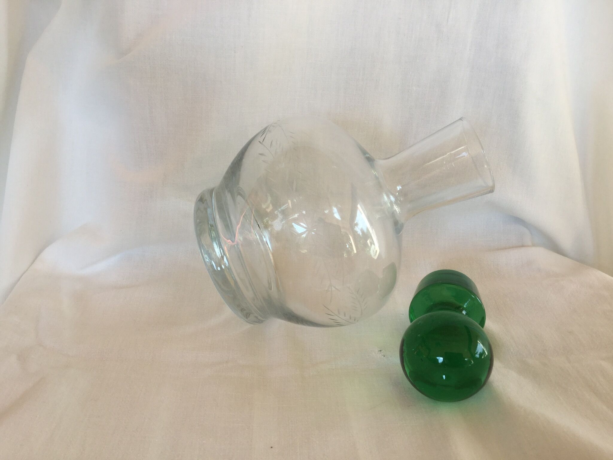 Glass wine carafe with green glass cap