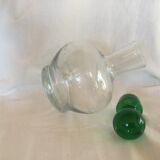Glass wine carafe with green glass cap