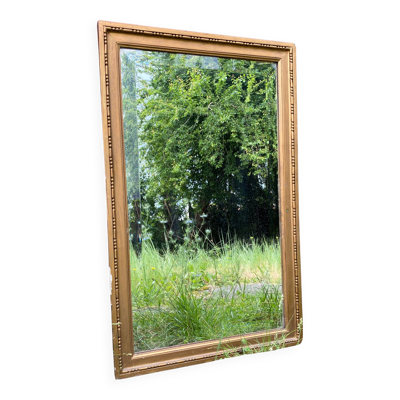 Miroir biseauté en bois doré de style Louis XVI, XIXème s.