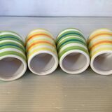 Four striped egg cups in yellow and green.
