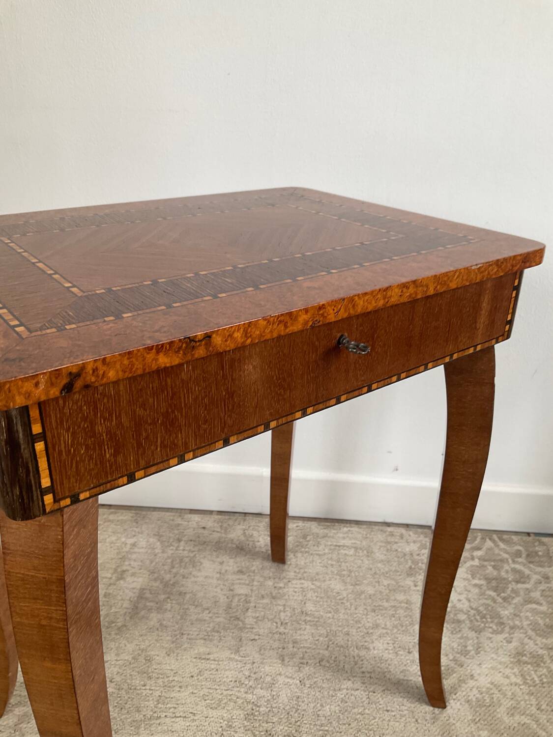 Small marquetry pedestal table with key storage