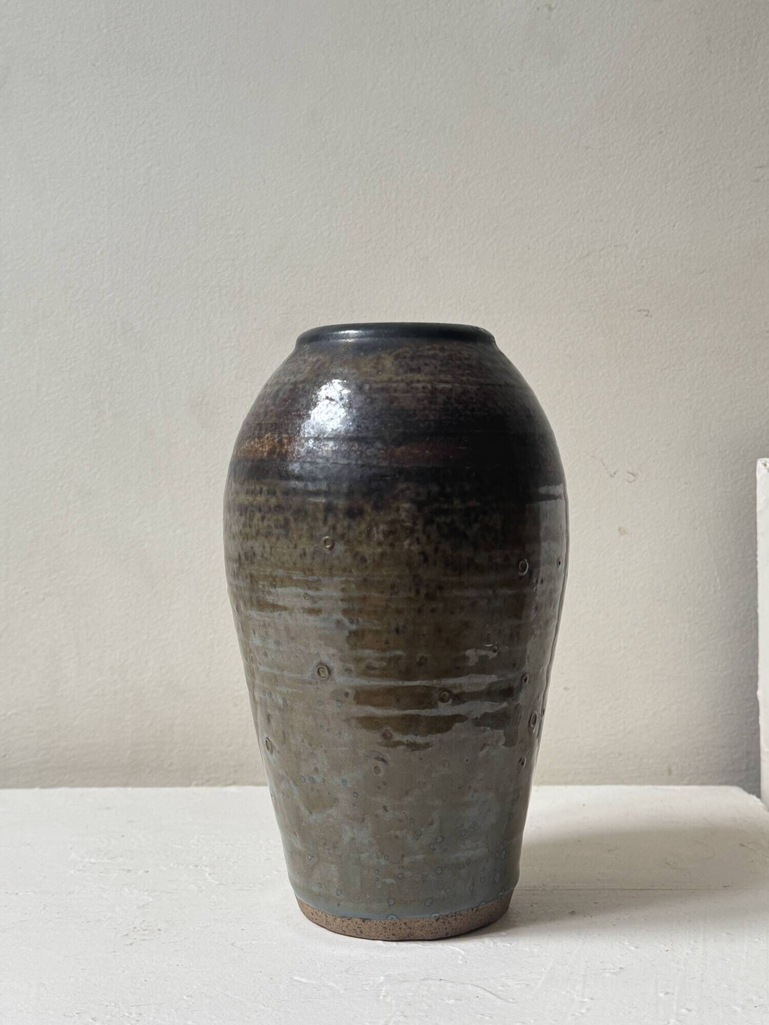 Brown-black glazed stoneware vase, signed underneath the base, circa 1950.