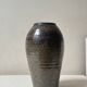 Brown-black glazed stoneware vase, signed underneath the base, circa 1950.