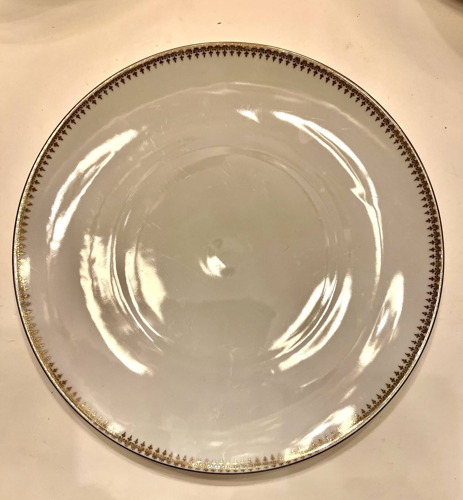 24 plates and a vintage porcelain dish decorated by Lucien Engel.