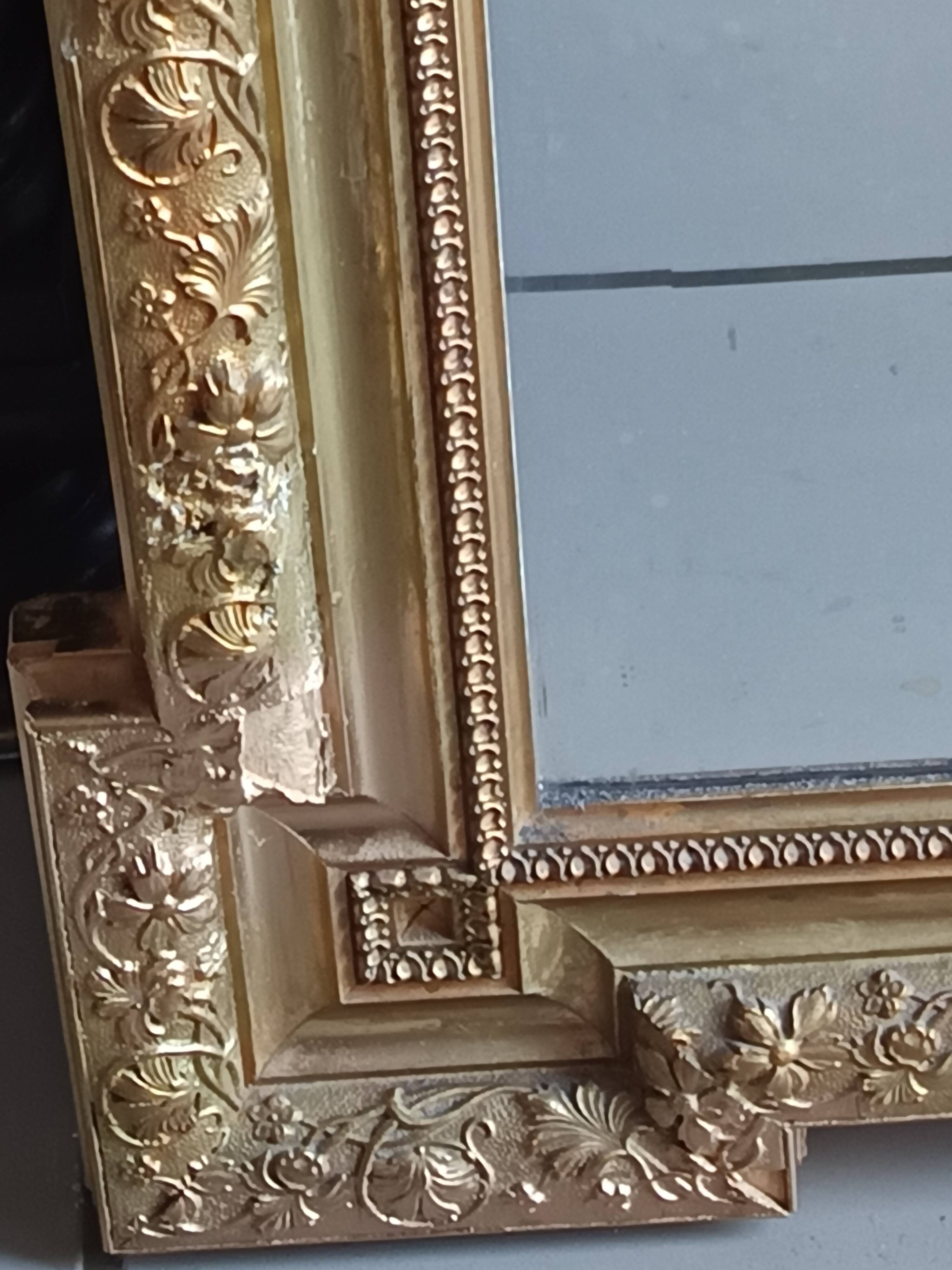 Antique mirror in wood and gilded stucco, neo Louis XVI style.