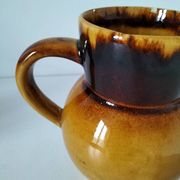 Glazed earthenware jug