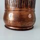 Vintage brutalist umbrella stand in hammered copper with a wood effect.