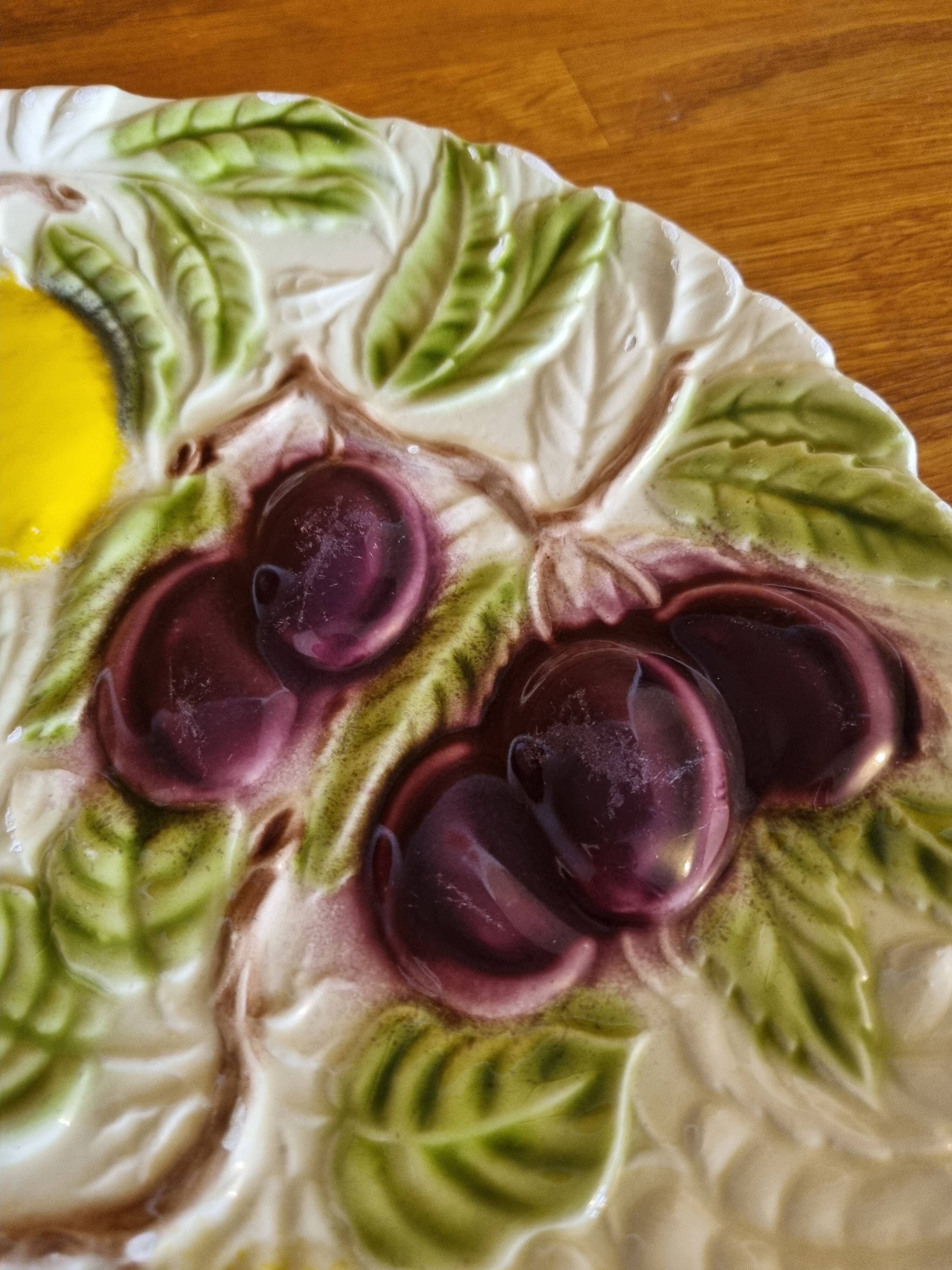 Large vintage earthenware dish with a fruit pattern.