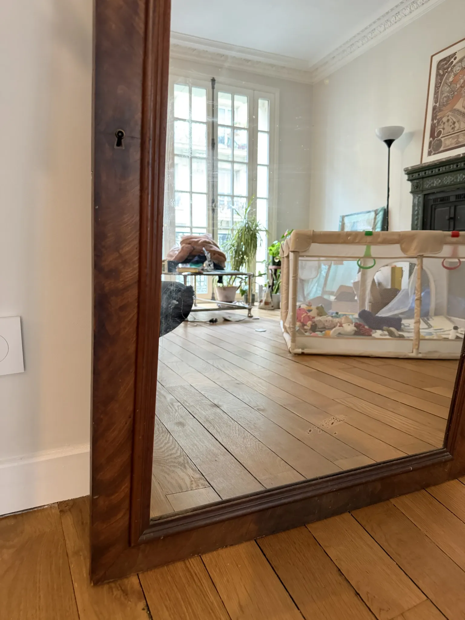 Large curved mirror with a wooden frame