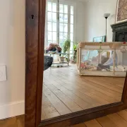 Large curved mirror with a wooden frame