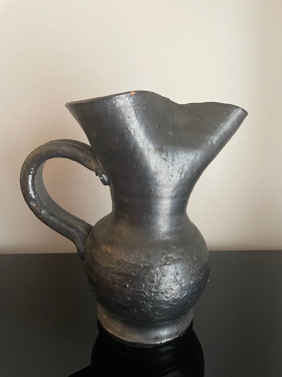 Black ceramic pitcher by Jean Marais
