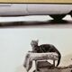 Photo of New York, Cat with rolling eyes in front of a shoe shine, 1960