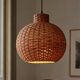 Large vintage lampshade made of hand-woven rattan.