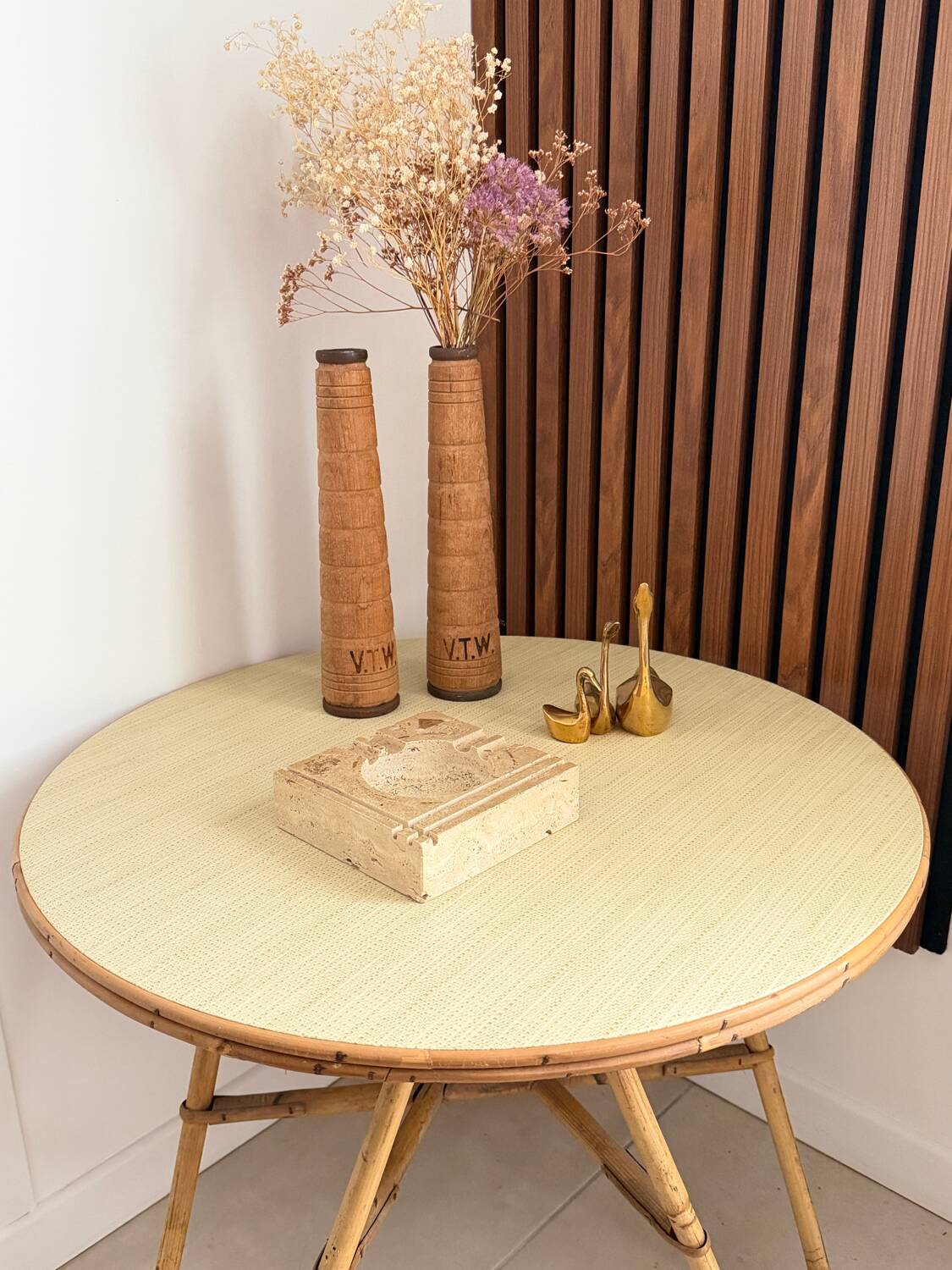 Vintage round tripod side table in rattan