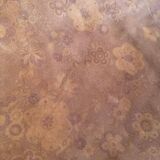 19th-century dark brown wrought-metal rocking chair with cognac leather sling seat, vintage