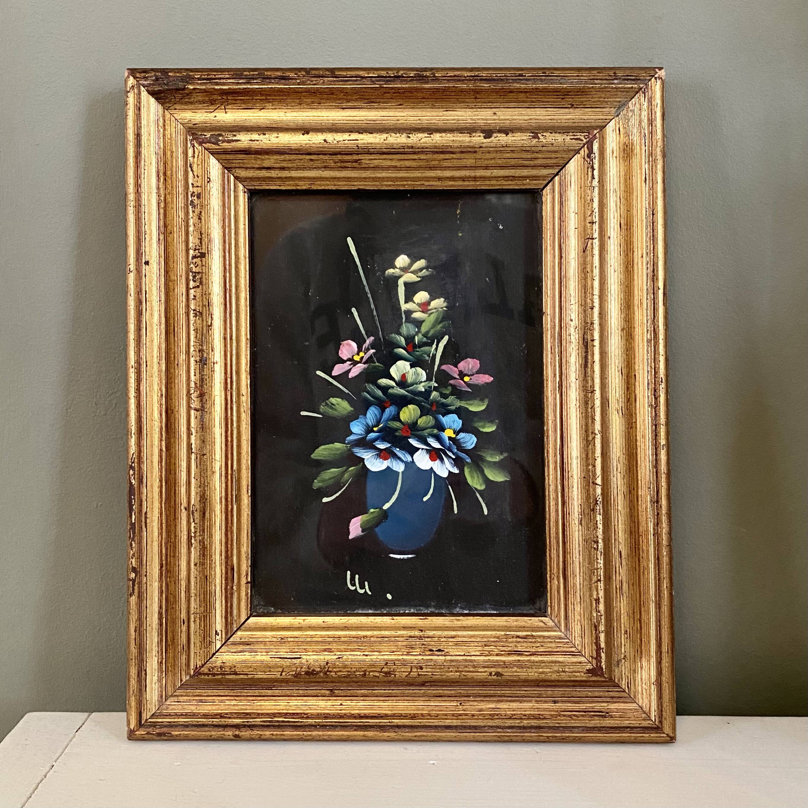 Golden frame with painting bouquet of flowers