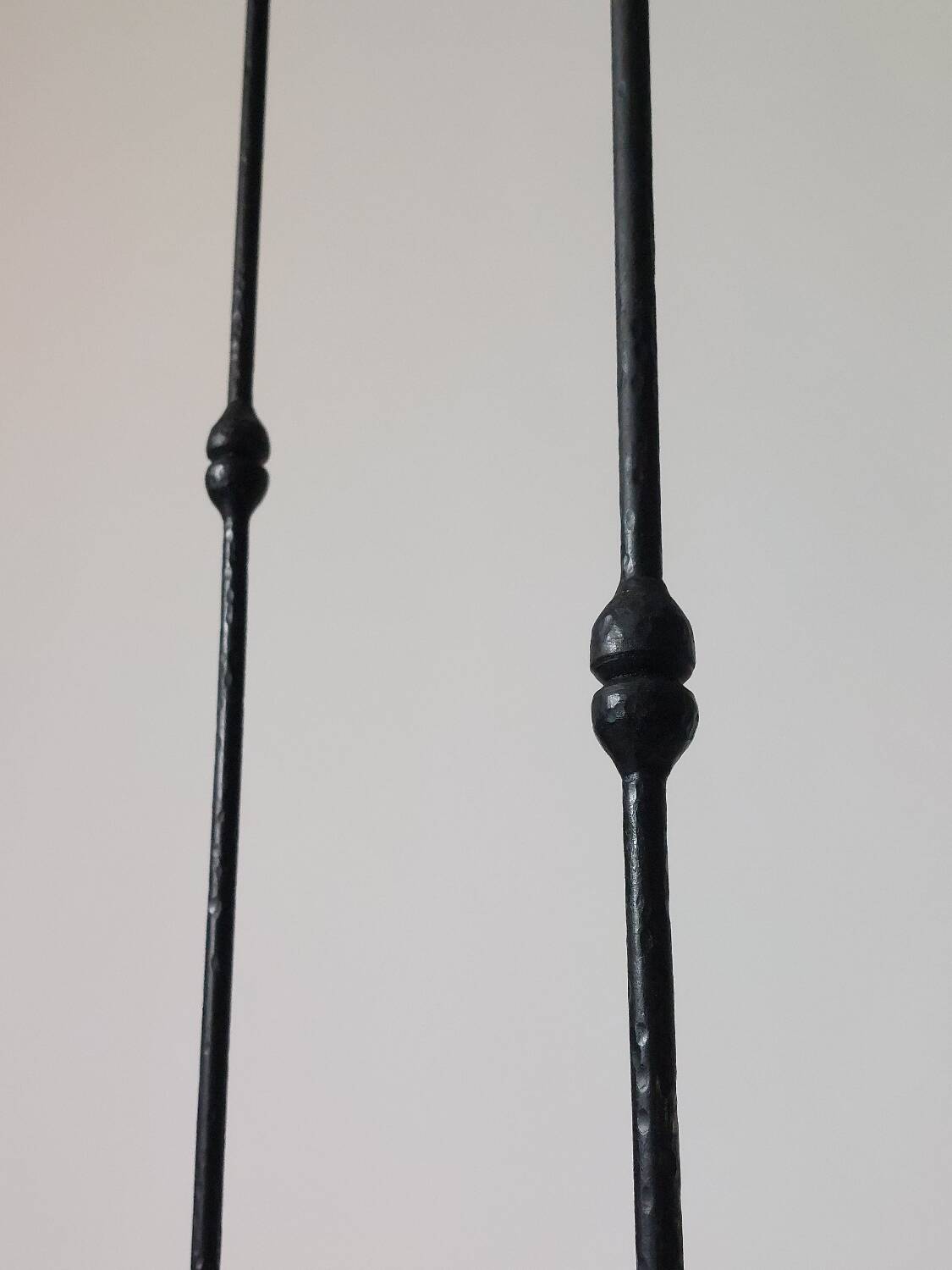 A pair of beautiful and exquisite vintage wrought iron candlesticks from the mid-century.