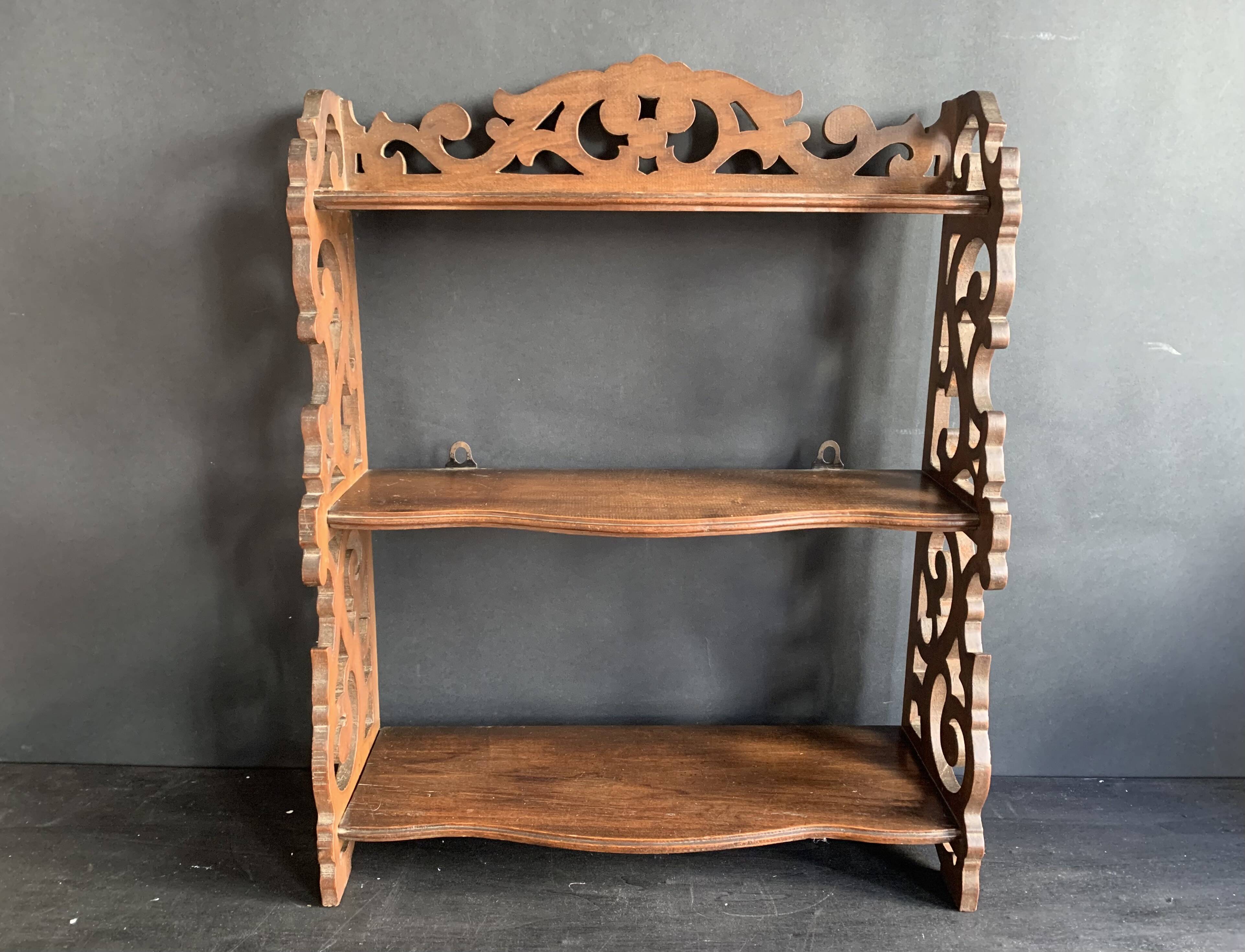 Antique shelf with openwork wooden pediment, early 20th century